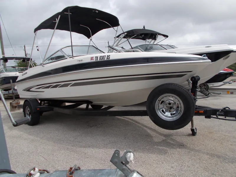 Slide: The Image of 2008 Glastron GT 205 boat on trailer with black bimini top. - 3