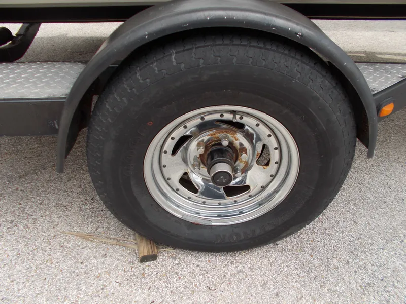 Slide: The Image of Close-up of a 2008 Glastron GT 205 trailer wheel and tire. - 4