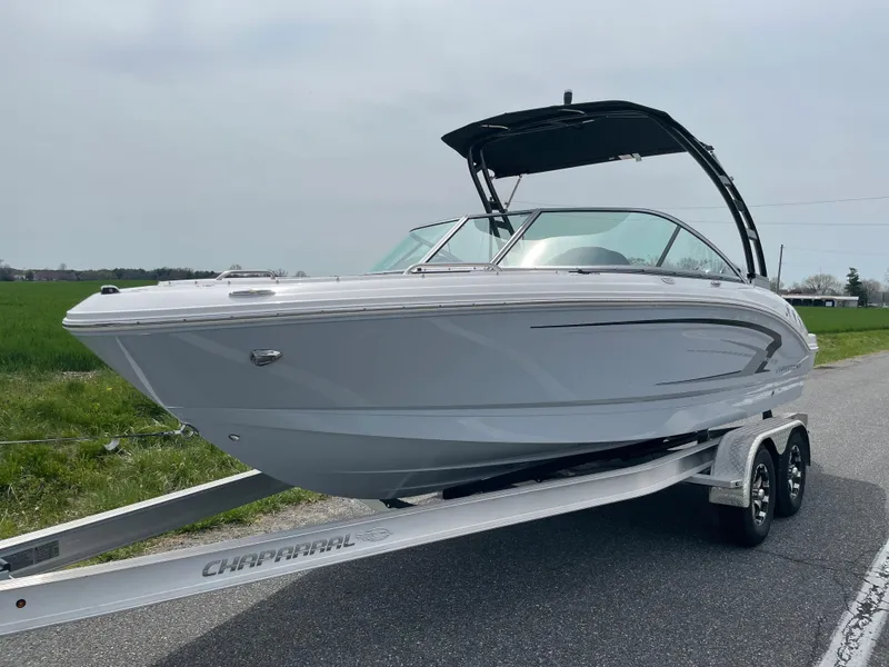 Slide: The Image of 2024 Chaparral 21 SSi OB boat on a trailer, side view. - 1