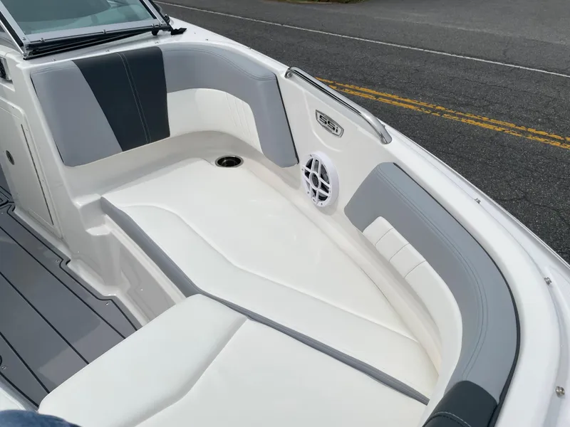 Slide: The Image of 2024 Chaparral 21 SSi OB boat interior with gray and white seating. - 10