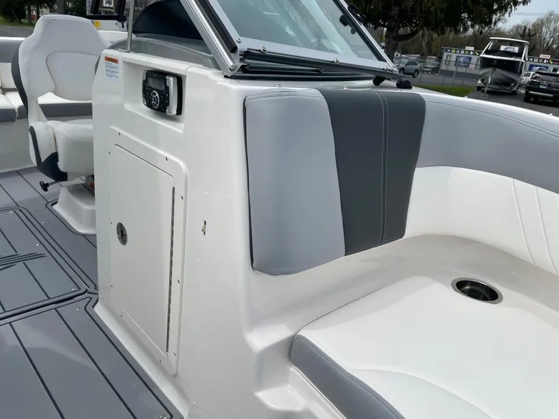 Slide: The Image of 2024 Chaparral 21 SSi OB boat interior with seating and storage compartment. - 14