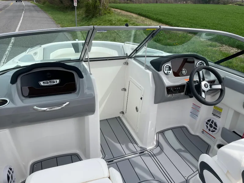 Slide: The Image of 2024 Chaparral 21 SSi OB boat interior with steering wheel and dashboard. - 19