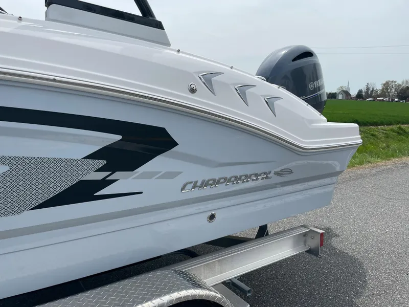 Slide: The Image of 2024 Chaparral 21 SSi OB boat on trailer, side view. - 3