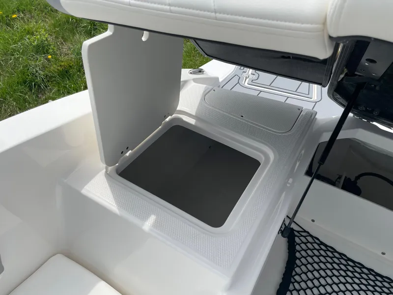 Slide: The Image of 2024 Chaparral 21 SSi OB boat storage compartment with open hatch. - 30