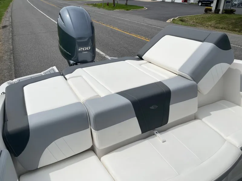 Slide: The Image of 2024 Chaparral 21 SSi OB boat with white and gray seating and 200 HP outboard motor. - 31