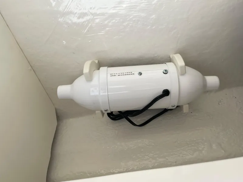 Slide: The Image of 2024 Chaparral 21 SSi OB boat component, white cylindrical device with wiring. - 34