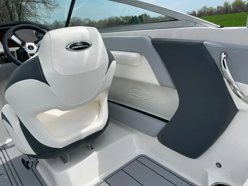 Slide: The Image of 2024 Chaparral 21 SSi OB boat interior with white and gray seating. - 38