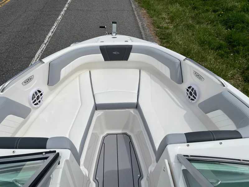 Slide: The Image of 2024 Chaparral 21 SSi OB boat interior with white and gray seating. - 4