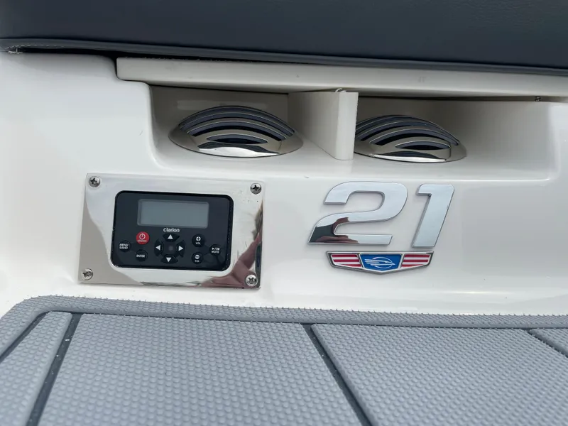 Slide: The Image of 2024 Chaparral 21 SSi OB boat dashboard with control panel and speakers. - 41