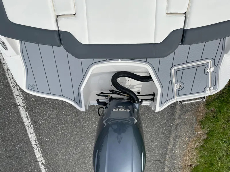 Slide: The Image of 2024 Chaparral 21 SSi OB boat stern with outboard motor and swim platform. - 42
