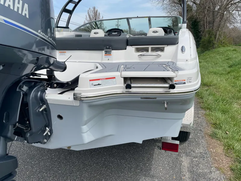 Slide: The Image of 2024 Chaparral 21 SSi OB boat rear view with Yamaha outboard motor. - 45
