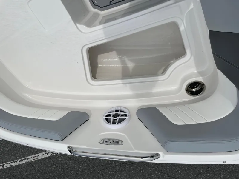Slide: The Image of 2024 Chaparral 21 SSi OB boat interior detail with seating and storage compartment. - 8
