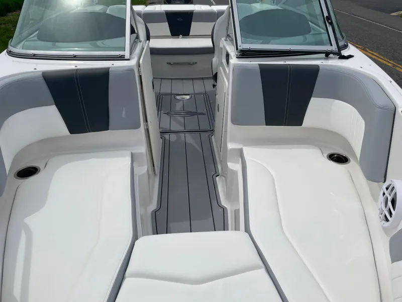 Slide: The Image of 2024 Chaparral 21 SSi OB boat interior with gray and white seating. - 9