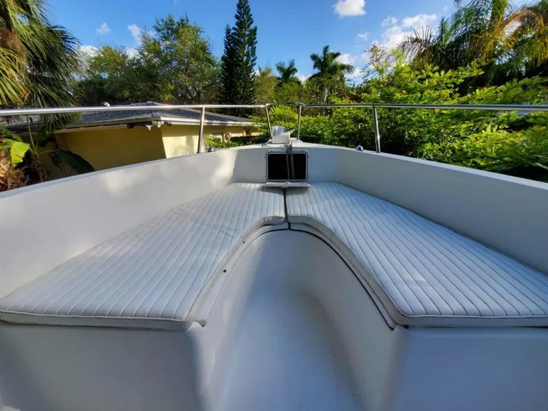 Slide: The Image of 2006 Sea Fox 256 Center Console boat with white cushioned seating. - 2