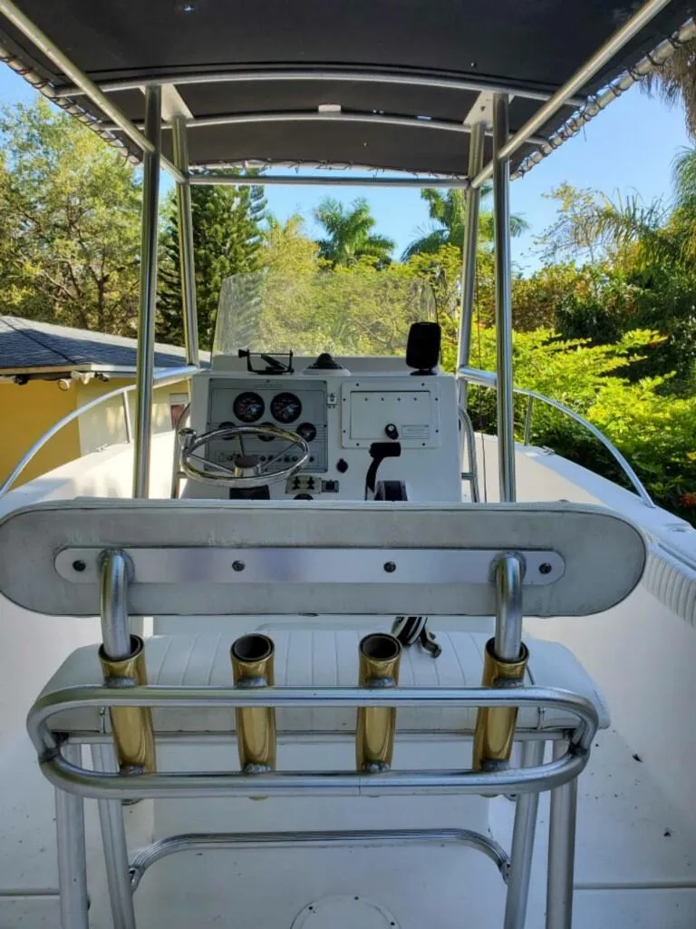 Slide: The Image of 2006 Sea Fox 256 Center Console boat with T-top and rod holders. - 7