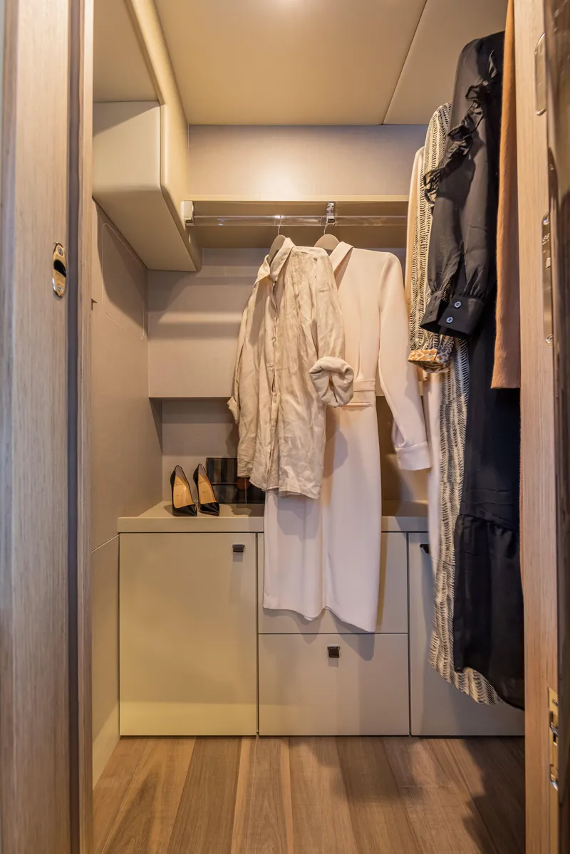 Slide: The Image of Luxurious closet in 2025 Absolute 56 FLY yacht with elegant clothing and shoes. - 20