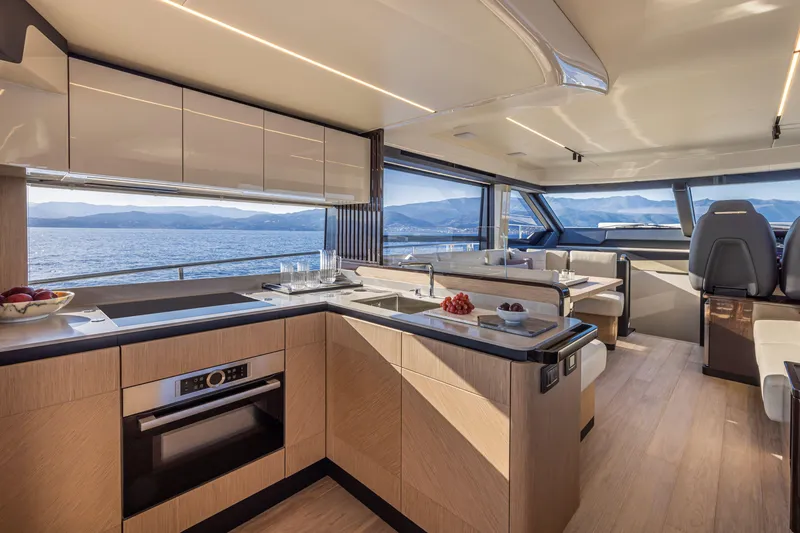 Slide: The Image of Luxurious interior of 2025 Absolute 56 FLY yacht with modern kitchen and ocean view. - 31