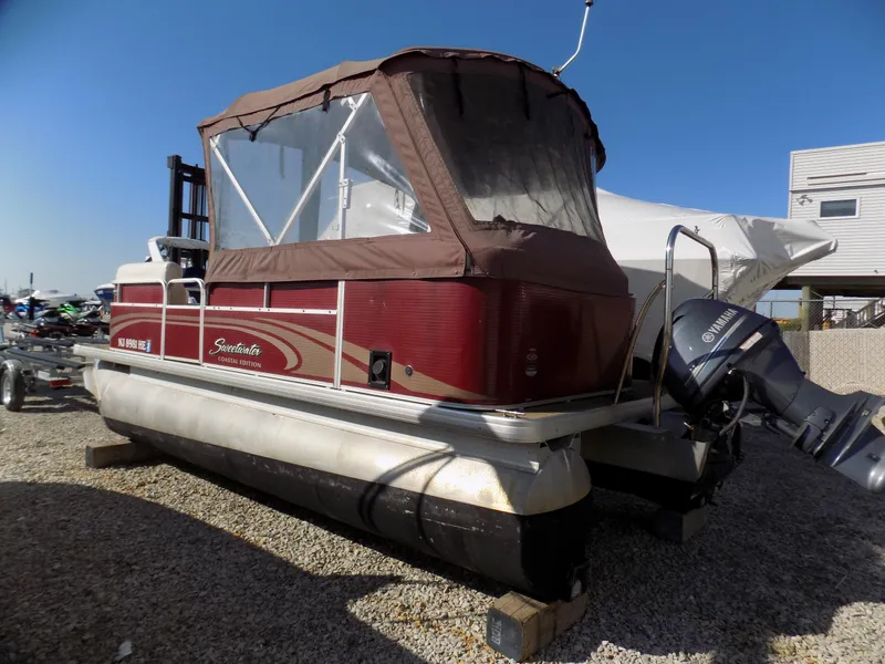 Slide: The Image of 2013 Sweetwater 2086 pontoon boat with canopy and Yamaha outboard motor. - 1