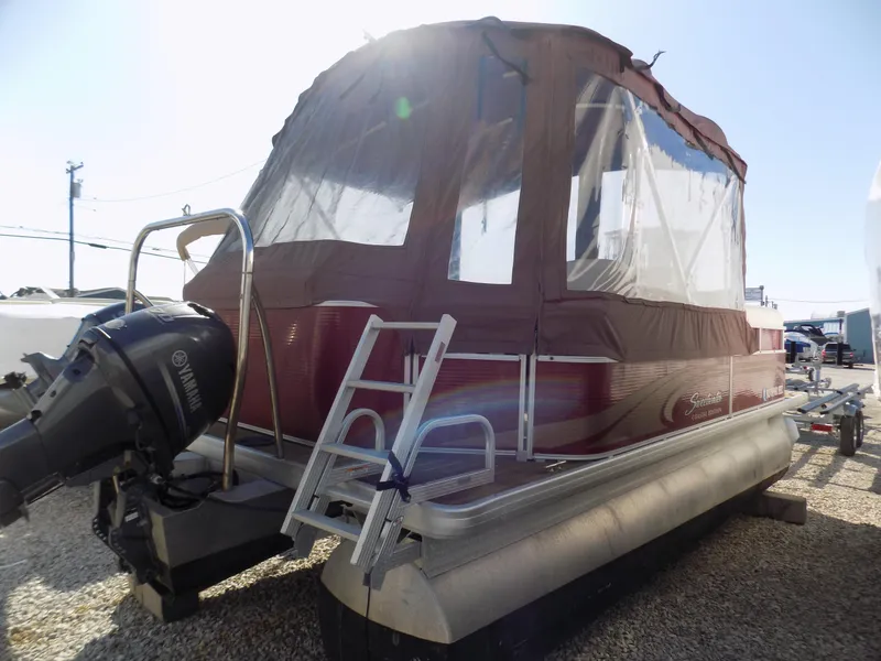 Slide: The Image of 2013 Sweetwater 2086 pontoon boat with canopy and Yamaha motor, parked on gravel. - 4