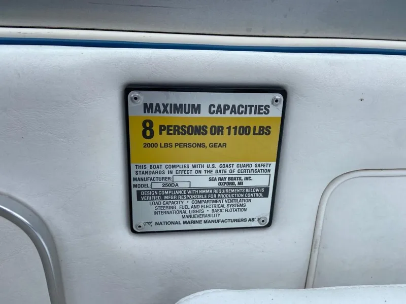 Slide: The Image of Capacity plate on 1989 Sea Ray Sundancer boat, max 8 persons or 1100 lbs. - 18