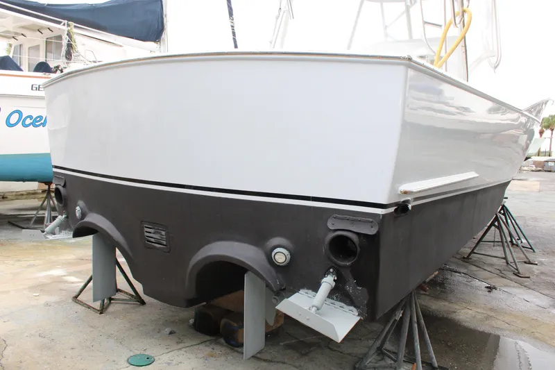 Slide: The Image of 2010 Legend 37 Walkaround boat on stands, rear view. - 18