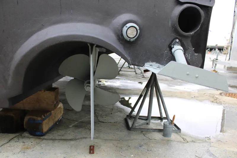 Slide: The Image of Propeller and rudder of 2010 Legend 37 Walkaround boat on dry dock. - 19