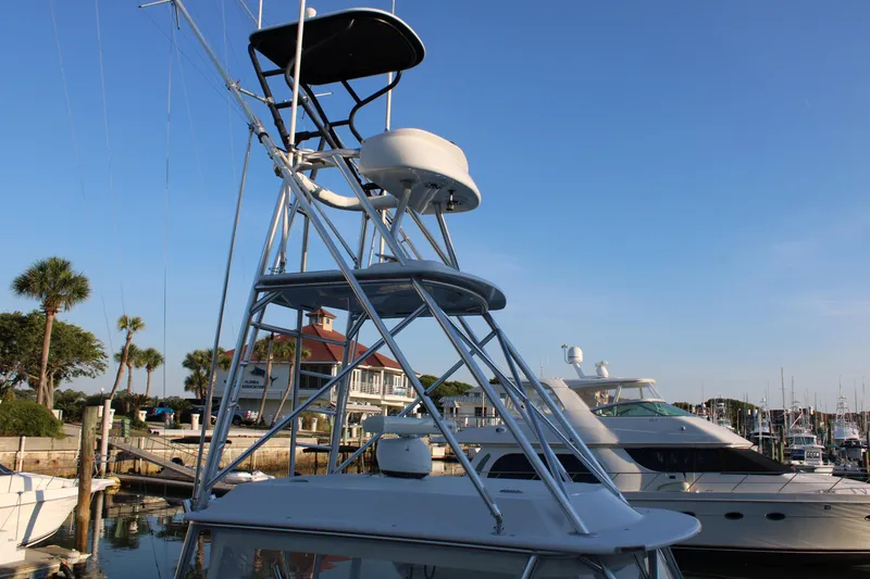 Slide: The Image of 2010 Legend 37 Walkaround boat with tower at marina. - 9