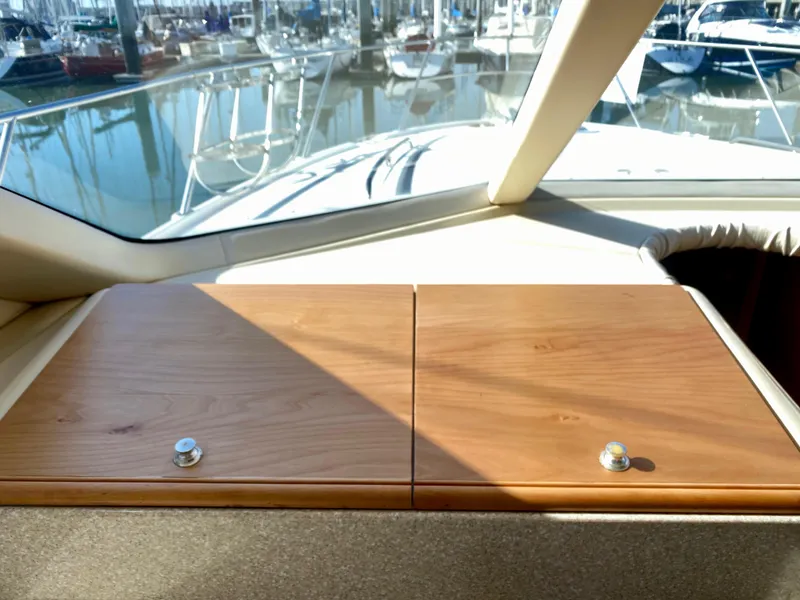 Slide: The Image of The 2004 Meridian 411 Sedan features a sleek wooden dashboard overlooking the marina. - 20