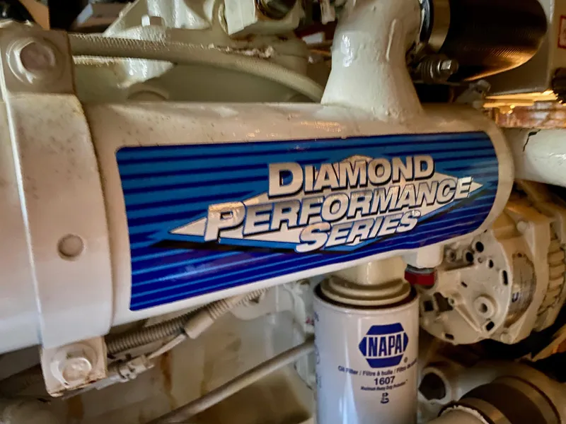 Slide: The Image of Close-up of a boat engine with a blue "Diamond Performance Series" label. - 31