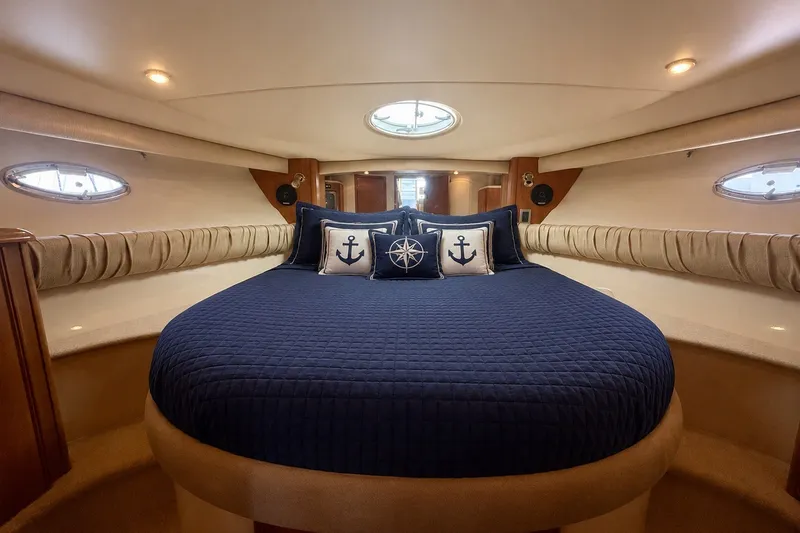 Slide: The Image of Owners stateroom forward with en suite head and stall shower - 9