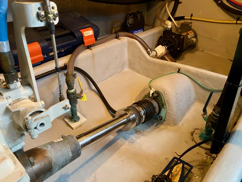 Slide: The Image of The engine room of a 2004 Meridian 411 Sedan shows technical components and wiring. - 35