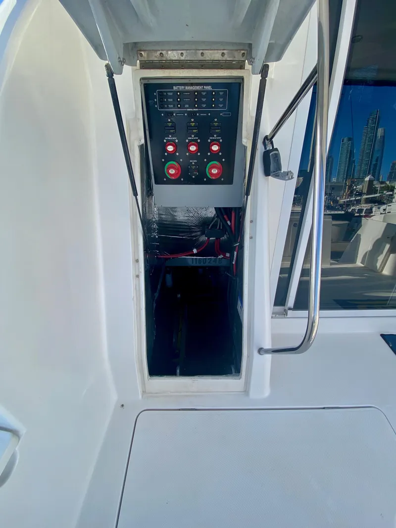 Slide: The Image of The image shows access to an electrical panel on a boat, surrounded by white surfaces. - 40