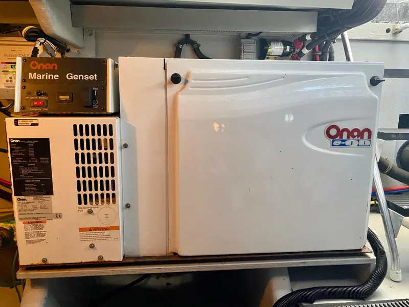 Slide: The Image of An Onan marine generator is installed in an engine room. It appears clean and well-maintained. - 38
