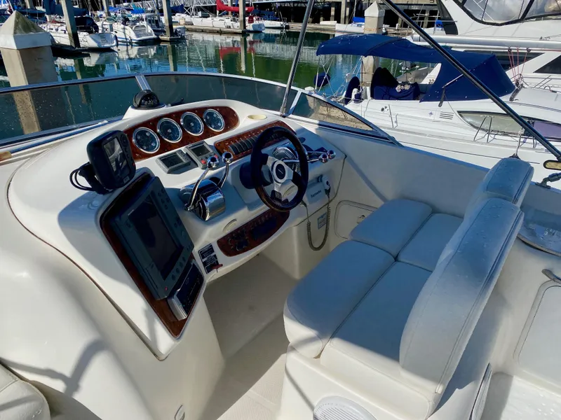 Slide: The Image of The cockpit of a 2004 Meridian 411 Sedan with modern instruments and comfortable seating. - 24