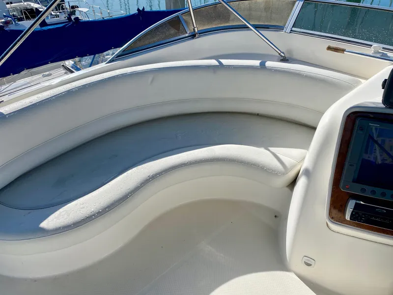 Slide: The Image of The image shows the cockpit of a 2004 Meridian 411 Sedan with curved white seating. - 27