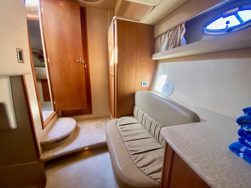 Slide: The Image of Interior of a 2004 Meridian 411 Sedan with beige sofa and wooden furnishings. - 30