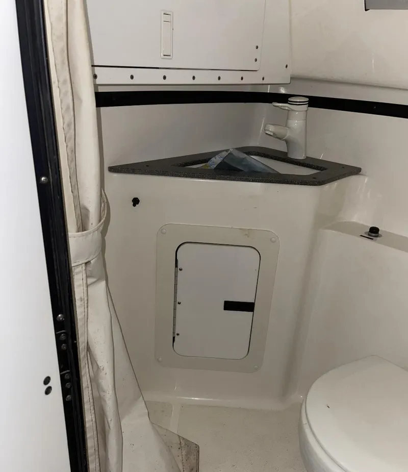 Slide: The Image of 1999 Fountain 47 Lightning boat bathroom with sink and toilet. - 19