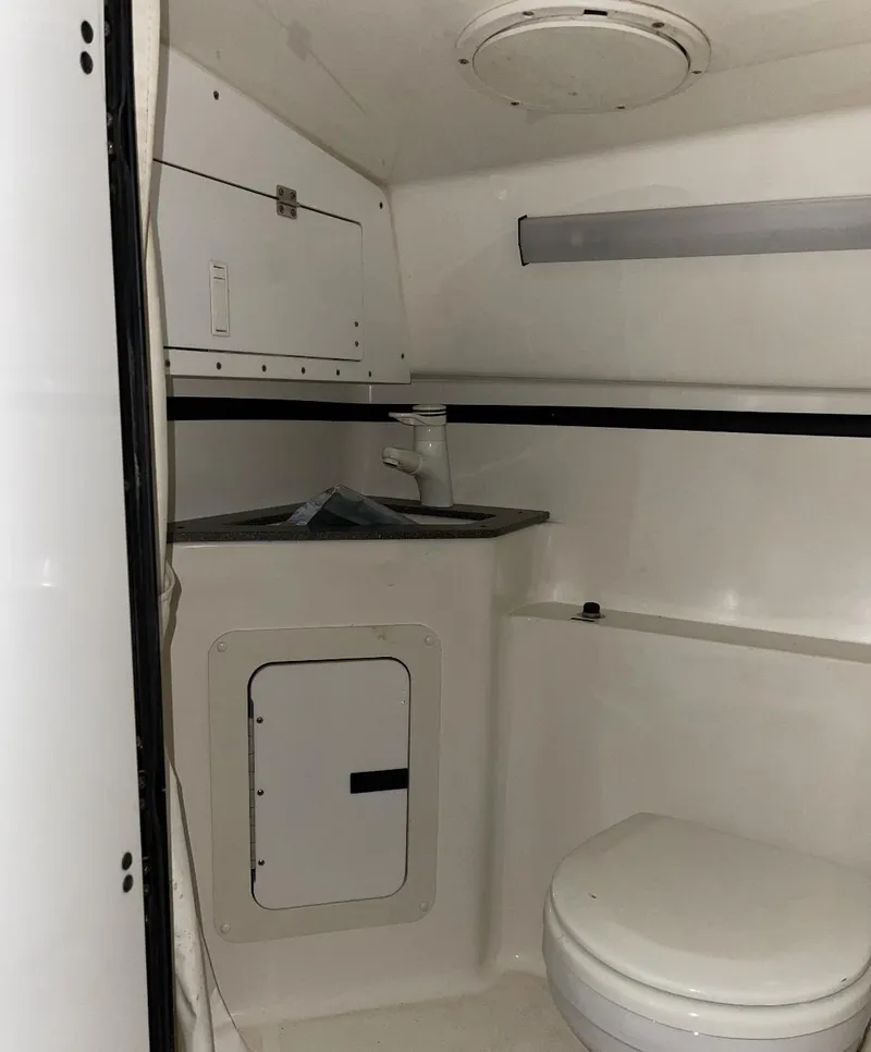 Slide: The Image of 1999 Fountain 47 Lightning boat interior bathroom with sink and toilet. - 20