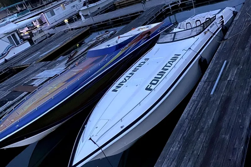 Slide: The Image of 1999 Fountain 47 Lightning speedboat docked at a marina. - 4