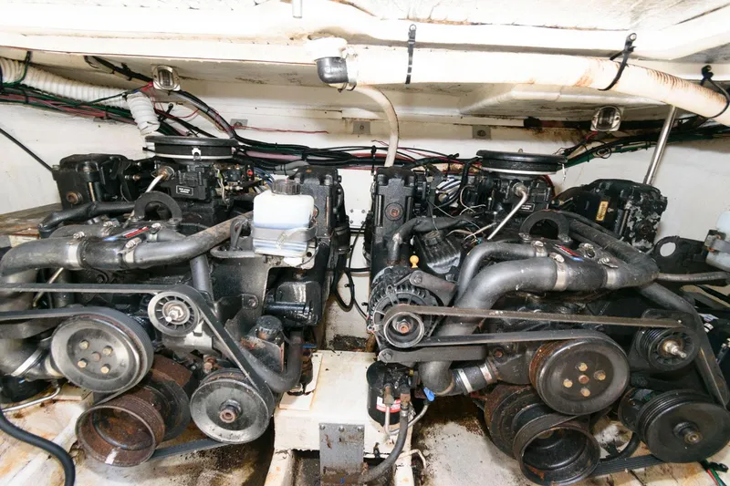 Slide: The Image of Twin engines of a 2000 Cruisers Yachts 2870 Express in the engine compartment. - 12