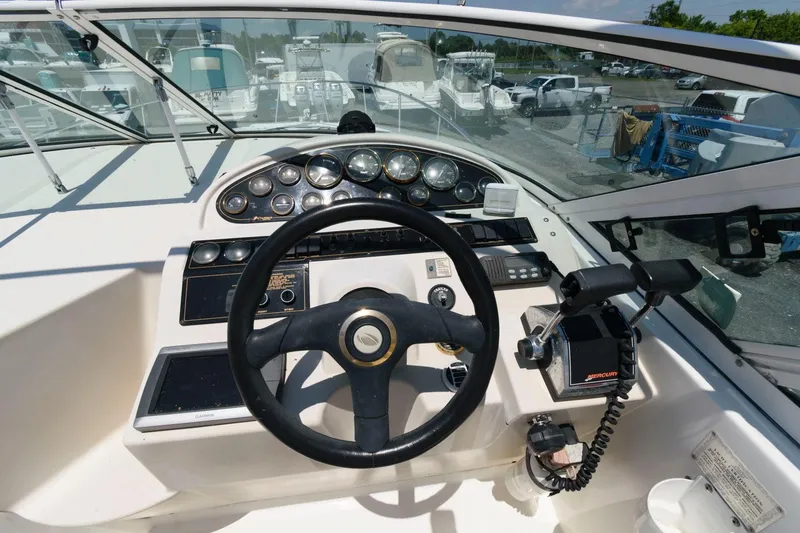 Slide: The Image of Steering console of a 2000 Cruisers Yachts 2870 Express boat. - 4