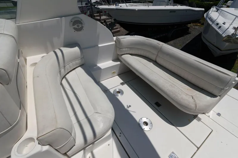 Slide: The Image of 2000 Cruisers Yachts 2870 Express boat interior with white seating. - 5