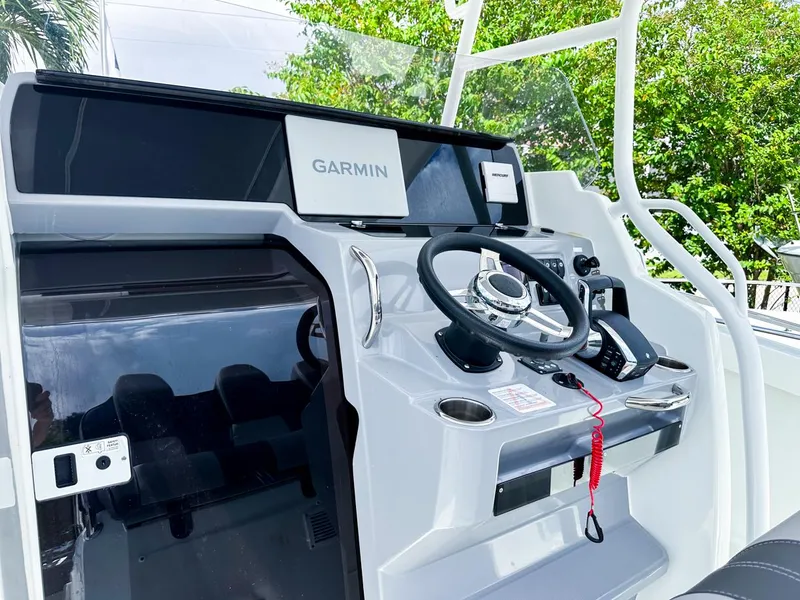 Slide: The Image of 2024 Jeanneau LEADER 9.0CC boat dashboard with Garmin navigation system. - 10