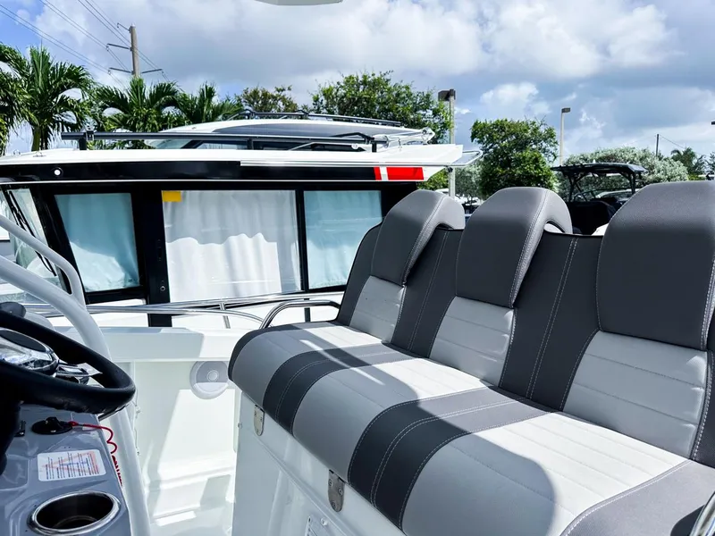 Slide: The Image of 2024 Jeanneau LEADER 9.0CC boat interior with sleek seating and modern design. - 13