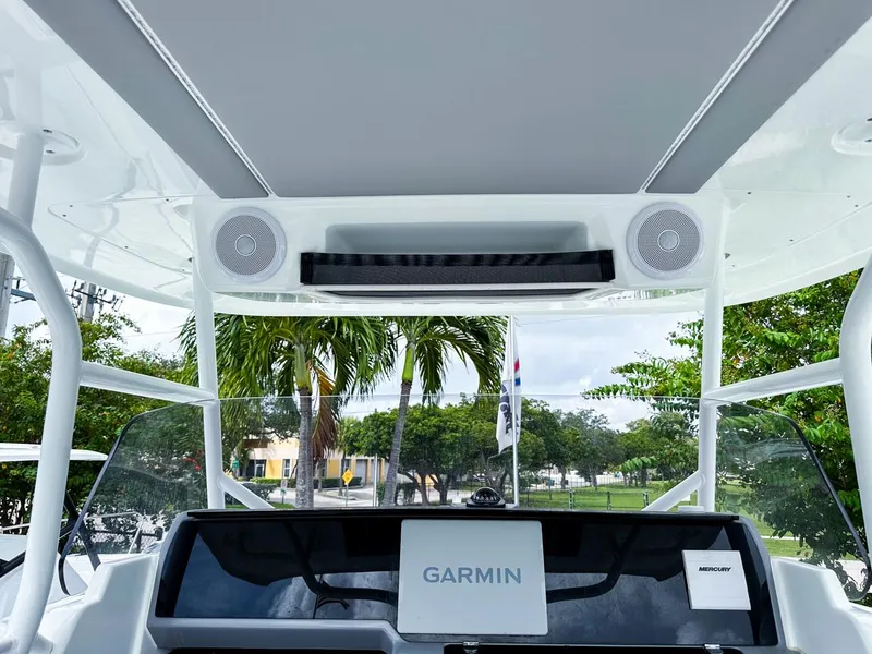 Slide: The Image of 2024 Jeanneau LEADER 9.0CC boat dashboard with Garmin navigation system and speakers. - 14
