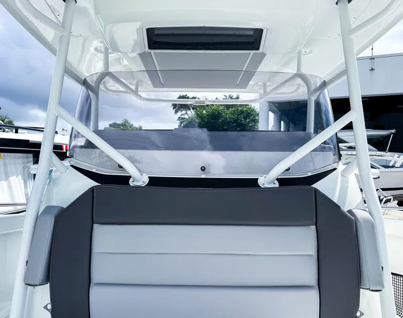 Slide: The Image of 2024 Jeanneau LEADER 9.0CC boat helm with modern design and sleek windshield. - 16