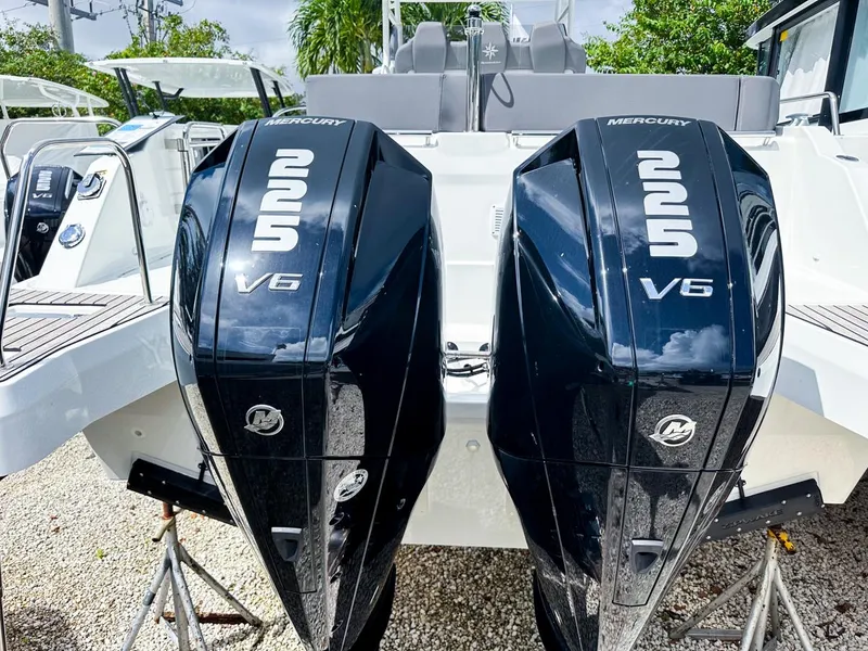 Slide: The Image of 2024 Jeanneau LEADER 9.0CC with twin Mercury 225 V6 engines, docked outdoors. - 6