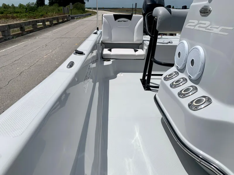 Slide: The Image of 2015 Epic 22SC Bay Boat interior view with seating and console. - 16