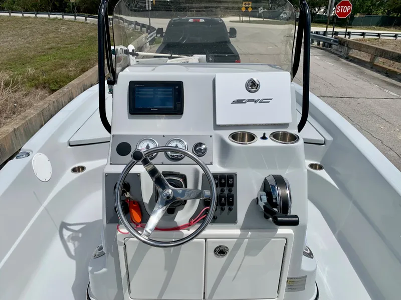 Slide: The Image of 2015 Epic 22SC Bay Boat console with steering wheel and navigation system. - 18