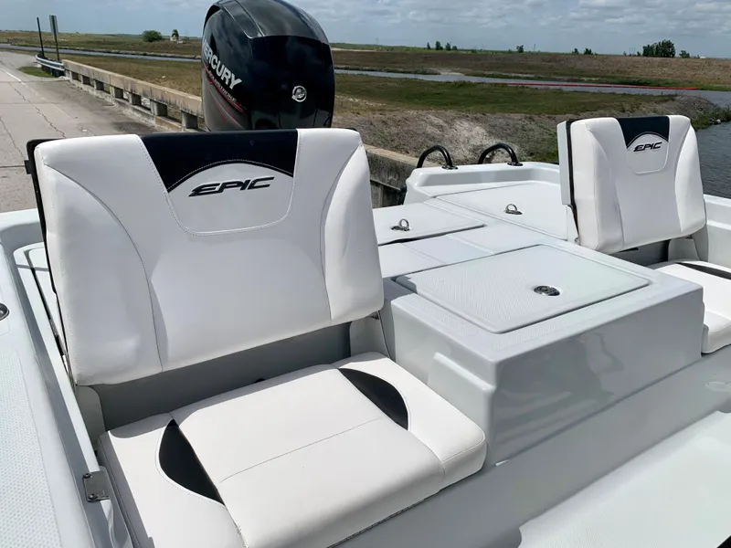 Slide: The Image of 2015 Epic 22SC Bay Boat with white seating and Mercury outboard motor. - 19